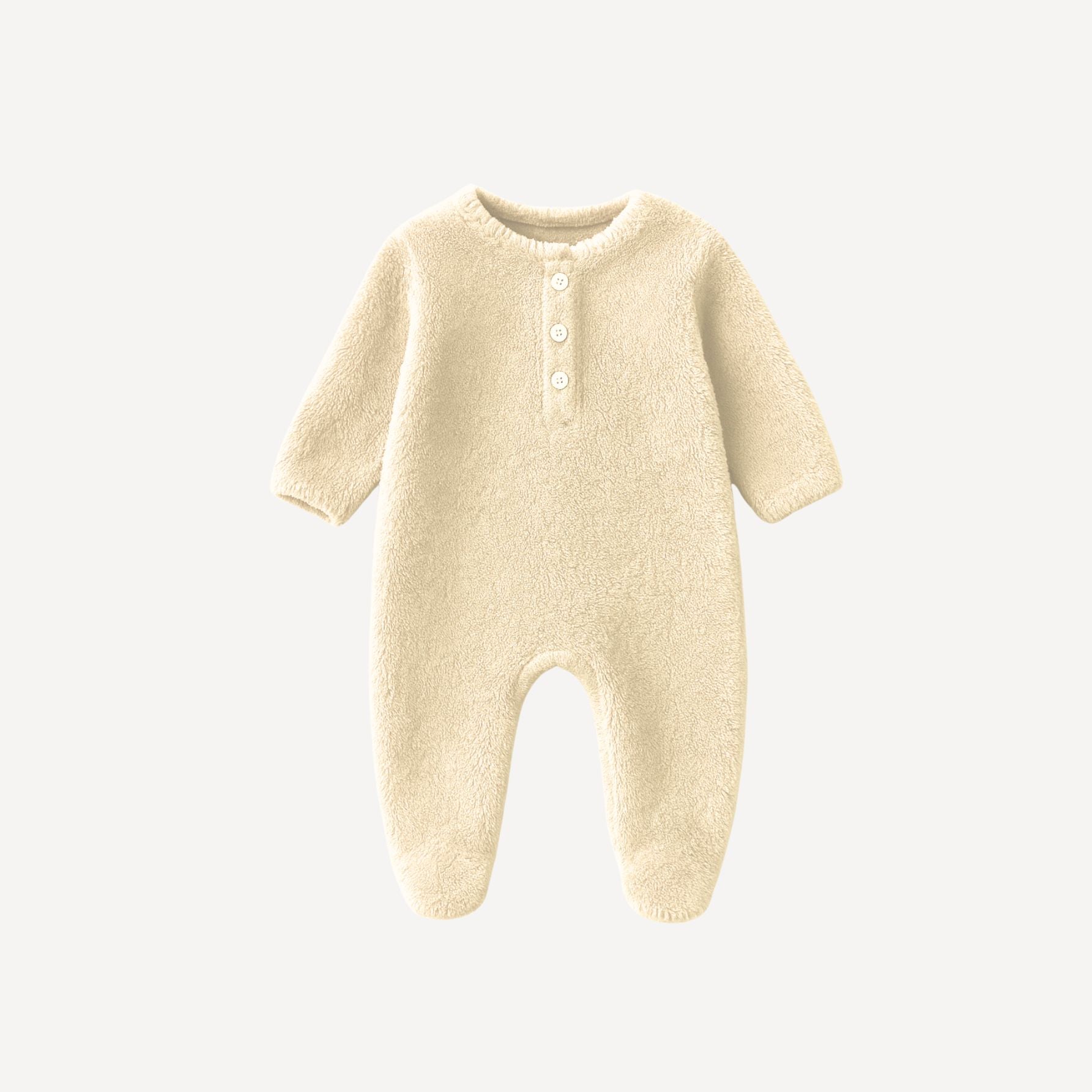 Notre pyjama en velours pour bébé, en écru naturel, offre un cocon de douceur et de chaleur, fidèle à l’élégance intemporelle de l’univers Bellemoon.
