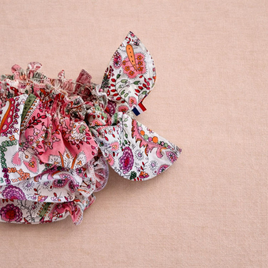 Maillot de bain bébé fleuri rose style bloomer Matholie, maillot bloomer à noeud