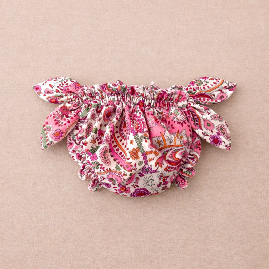 Maillot de bain bébé fleuri rose style bloomer Matholie, maillot bloomer à noeud