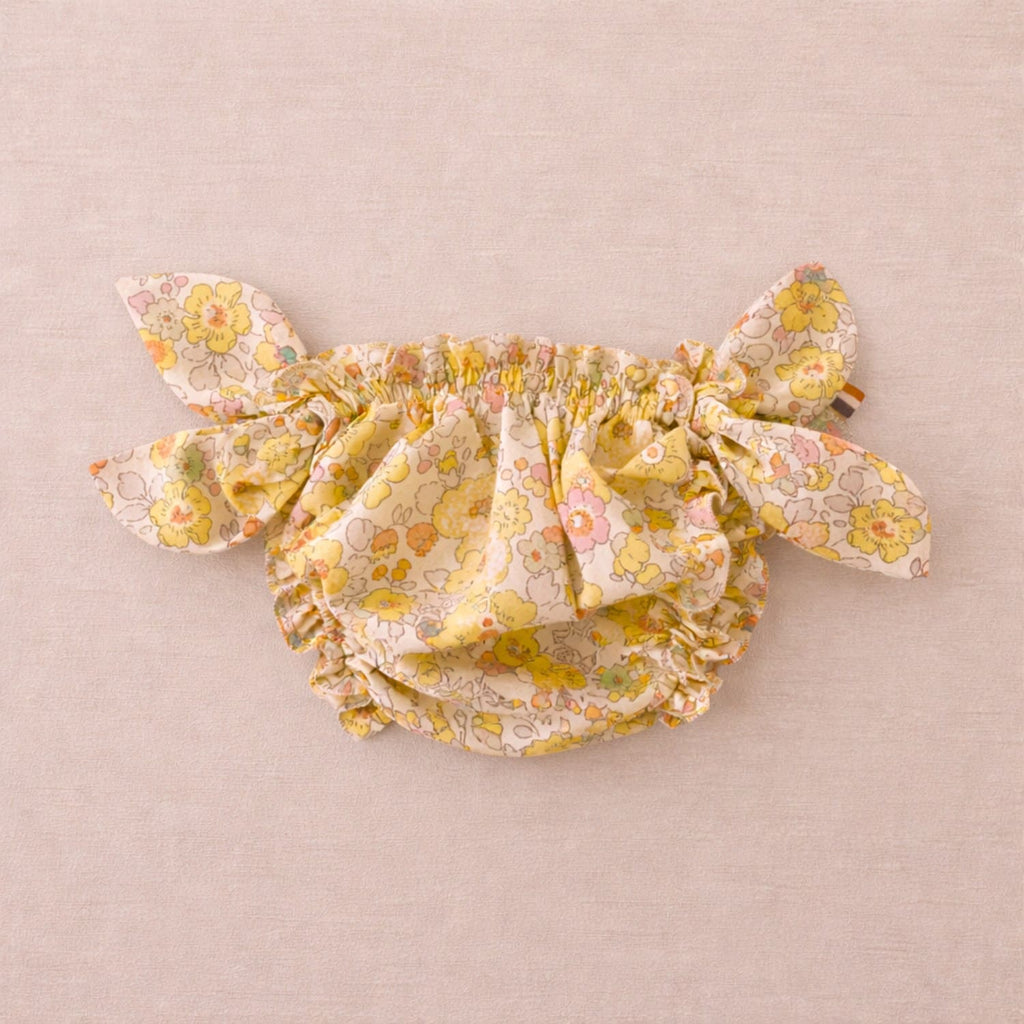 Maillot de bain pour bébé à motifs floraux jaunes avec nœuds sur les côtés, maillot bloomer