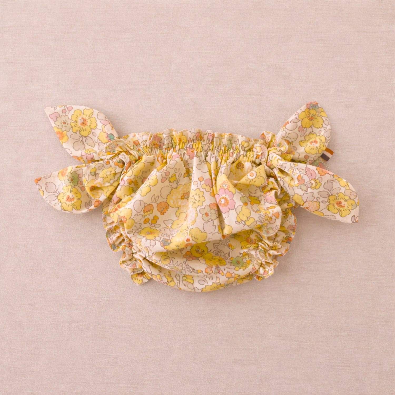 Maillot de bain pour bébé à motifs floraux jaunes avec nœuds sur les côtés, maillot bloomer